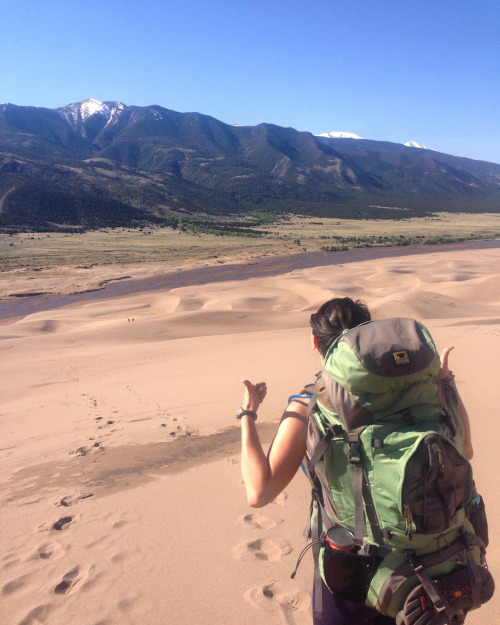 A beautiful landscape including the Great Sand Dunes with a backdrop of the Rocky Mountains
